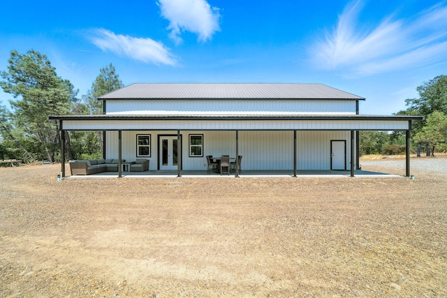 23795 Deer Canyon Rd, Millville, CA 96062 - view of front of home featuring an outdoor living space, french doors, a metal roof, and a patio area