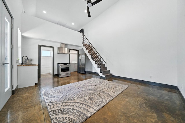 23795 Deer Canyon Rd, Millville, CA 96062 - living room with stairs, recessed lighting, concrete floors, and a towering ceiling