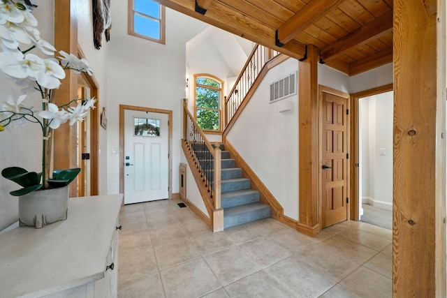 23795 Deer Canyon Rd, Millville, CA 96062 - foyer with a wood ceiling with exposed beams, stairs, and light tile patterned flooring