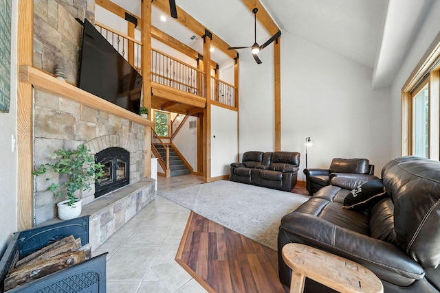 23795 Deer Canyon Rd, Millville, CA 96062 - living area with high vaulted ceiling, a fireplace, tile patterned flooring, and stairs