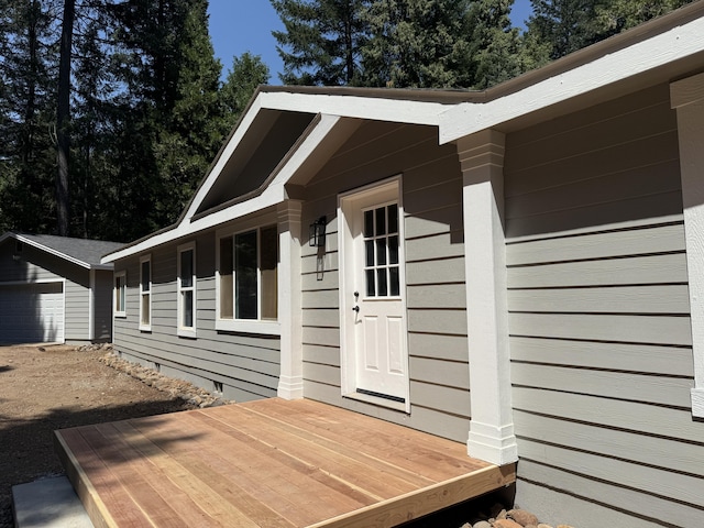 10360 Ritts Mill Rd, Shingletown, CA 96088 - view of side of home with a garage and a wooden deck