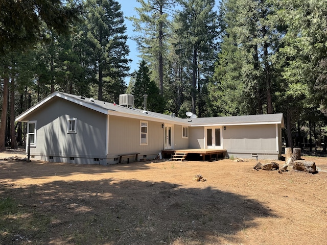 10360 Ritts Mill Rd, Shingletown, CA 96088 - back of house with crawl space, a wooden deck, french doors, and view of scattered trees