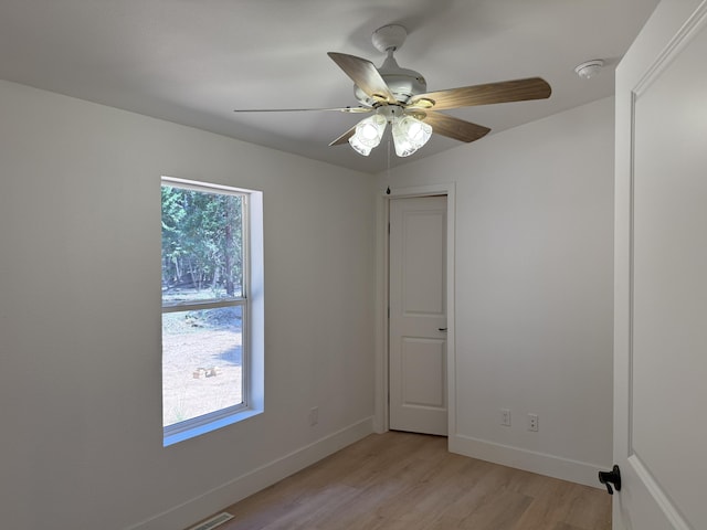 10360 Ritts Mill Rd, Shingletown, CA 96088 - spare room with light wood-style floors, ceiling fan, and a smoke detector