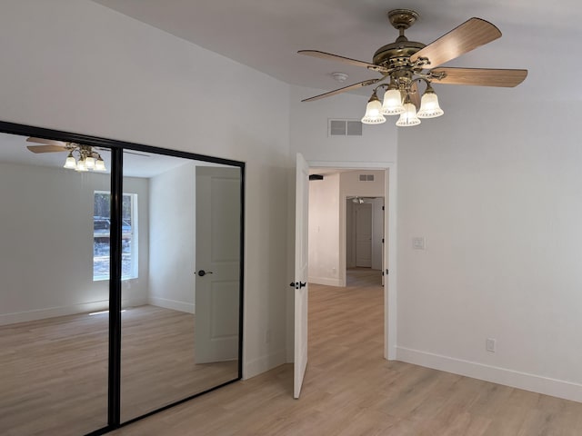 10360 Ritts Mill Rd, Shingletown, CA 96088 - unfurnished bedroom with light wood-style floors, a ceiling fan, and a closet