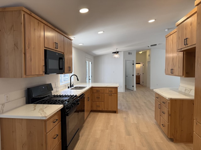 10360 Ritts Mill Rd, Shingletown, CA 96088 - kitchen with black appliances, a peninsula, light wood-type flooring, and recessed lighting