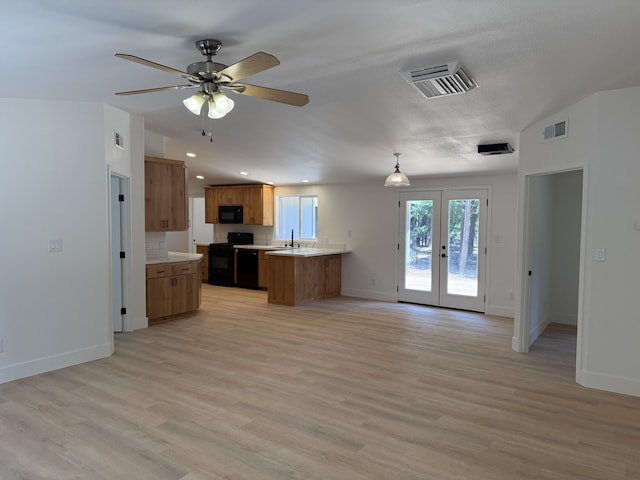 10360 Ritts Mill Rd, Shingletown, CA 96088 - kitchen with black appliances, open floor plan, brown cabinets, light countertops, and french doors