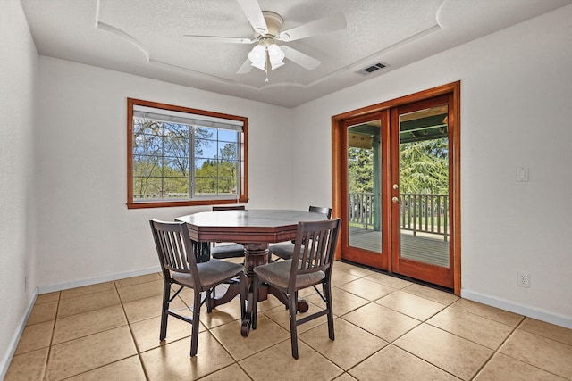 12526 Glide Way, Redding, CA 96003 - dining space with plenty of natural light, a textured ceiling, french doors, light tile patterned flooring, and a ceiling fan