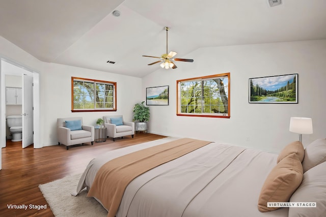 12526 Glide Way, Redding, CA 96003 - bedroom with lofted ceiling, wood finished floors, multiple windows, connected bathroom, and a ceiling fan