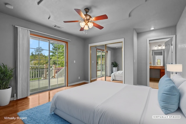12526 Glide Way, Redding, CA 96003 - bedroom with access to exterior, wood finished floors, ensuite bath, a closet, and a ceiling fan