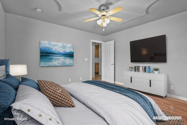 12526 Glide Way, Redding, CA 96003 - bedroom with wood finished floors and a ceiling fan