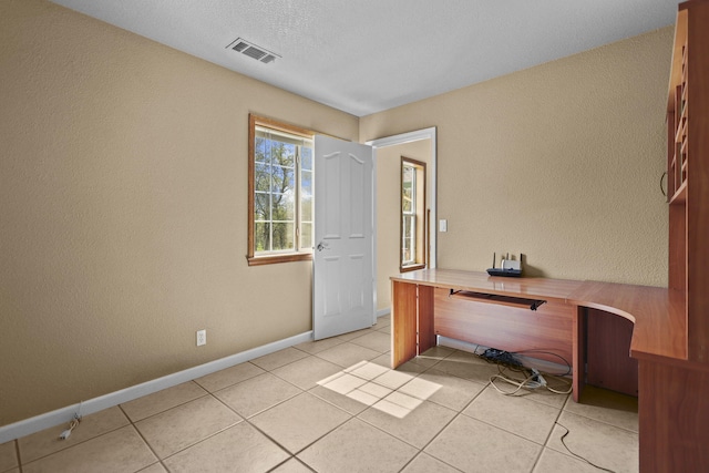 12526 Glide Way, Redding, CA 96003 - unfurnished office featuring light tile patterned floors and a textured wall