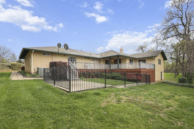12526 Glide Way, Redding, CA 96003 - rear view of property with a patio, stucco siding, a wooden deck, and a lawn