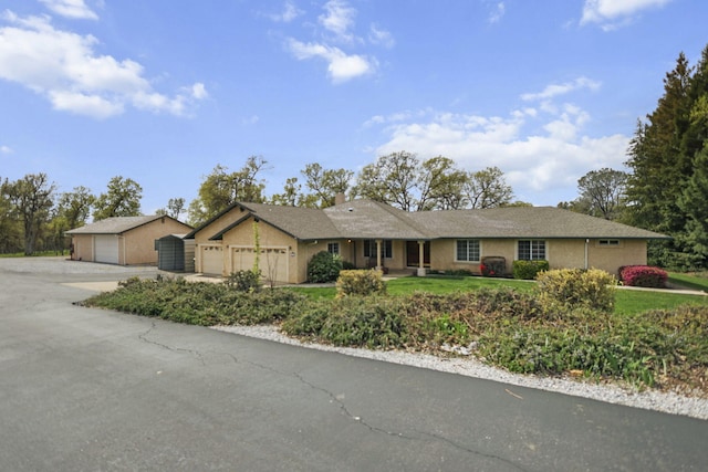 12526 Glide Way, Redding, CA 96003 - ranch-style home with driveway, a chimney, a front yard, and stucco siding