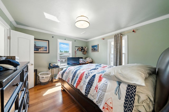 1635 Pleasant St, Redding, CA 96001 - bedroom with light wood-style flooring and ornamental molding