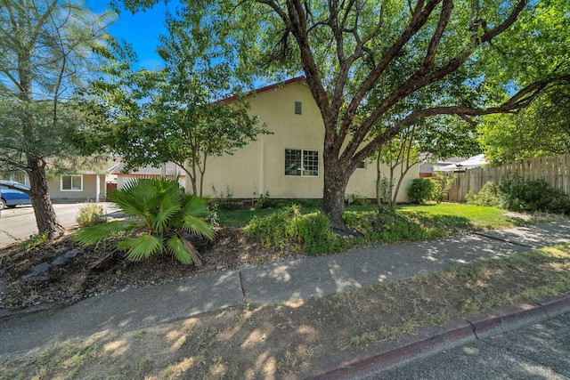 1635 Pleasant St, Redding, CA 96001 - view of side of property featuring stucco siding
