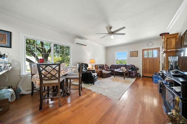 1635 Pleasant St, Redding, CA 96001 - living area with a wall unit AC, crown molding, light wood-type flooring, and a ceiling fan