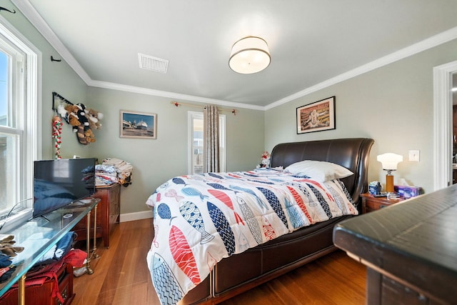 1635 Pleasant St, Redding, CA 96001 - bedroom featuring crown molding and wood finished floors