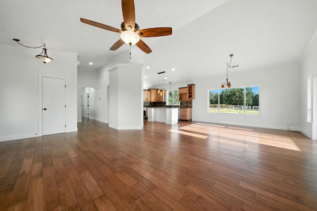 18435 Danielle Way, Cottonwood, CA 96022 - unfurnished living room featuring a ceiling fan, arched walkways, dark wood finished floors, and recessed lighting