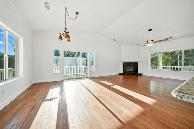 18435 Danielle Way, Cottonwood, CA 96022 - unfurnished living room featuring healthy amount of natural light, ceiling fan, a chandelier, and lofted ceiling