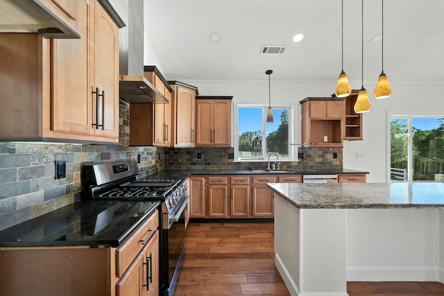 18435 Danielle Way, Cottonwood, CA 96022 - kitchen with stainless steel gas range, crown molding, island exhaust hood, dark wood-type flooring, and dark stone countertops