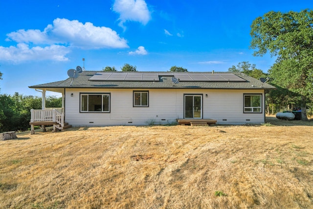 18435 Danielle Way, Cottonwood, CA 96022 - rear view of house with crawl space, solar panels, roof with shingles, and a lawn