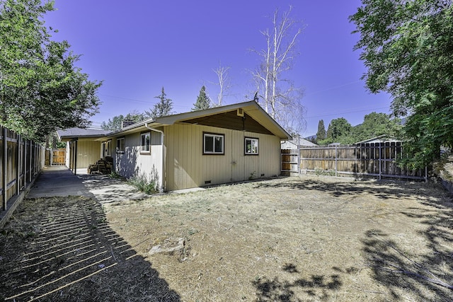 210 Sherman St, Yreka, CA 96097 - rear view of house with a fenced backyard