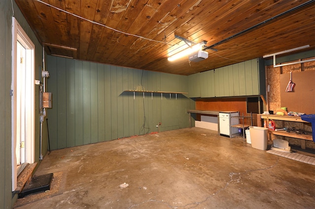 210 Sherman St, Yreka, CA 96097 - basement with a garage, a workshop area, wooden ceiling, and wood walls