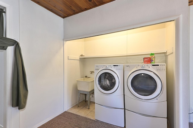 210 Sherman St, Yreka, CA 96097 - washroom featuring washer and clothes dryer, wooden ceiling, light tile patterned floors, and light carpet