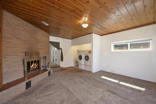 210 Sherman St, Yreka, CA 96097 - unfurnished living room with separate washer and dryer, carpet, a brick fireplace, wood ceiling, and vaulted ceiling