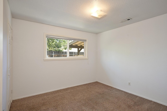 210 Sherman St, Yreka, CA 96097 - empty room featuring carpet floors and a textured ceiling