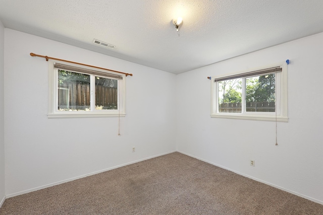 210 Sherman St, Yreka, CA 96097 - empty room with carpet flooring and a textured ceiling
