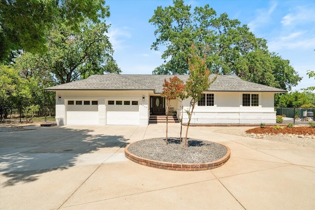 2949 Felstet Ln, Redding, CA 96001 - ranch-style house featuring concrete driveway, brick siding, an attached garage, and a shingled roof