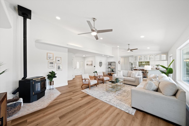 2949 Felstet Ln, Redding, CA 96001 - living room with a wood stove, ceiling fan, light wood-style flooring, and recessed lighting