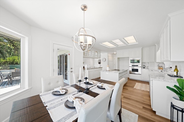 2949 Felstet Ln, Redding, CA 96001 - dining room with a chandelier and light wood finished floors