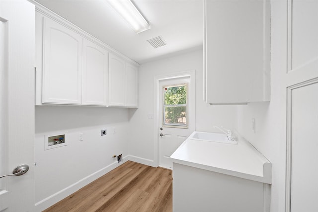 2949 Felstet Ln, Redding, CA 96001 - laundry area with cabinet space, hookup for a gas dryer, electric dryer hookup, light wood finished floors, and washer hookup