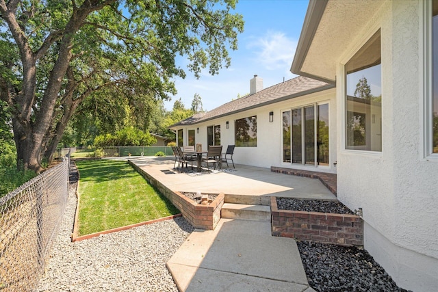 2949 Felstet Ln, Redding, CA 96001 - fenced backyard with a patio