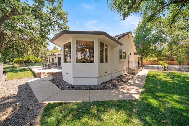 2949 Felstet Ln, Redding, CA 96001 - view of property exterior with stucco siding, a patio area, and crawl space