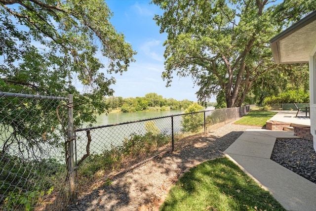 2949 Felstet Ln, Redding, CA 96001 - fenced backyard with a water view and a patio