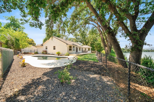 2949 Felstet Ln, Redding, CA 96001 - fenced backyard featuring a patio area and a water view