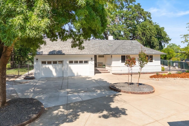2949 Felstet Ln, Redding, CA 96001 - ranch-style home featuring concrete driveway, a shingled roof, and brick siding