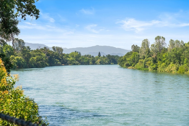 2949 Felstet Ln, Redding, CA 96001 - water view featuring a heavily wooded area and a mountain backdrop