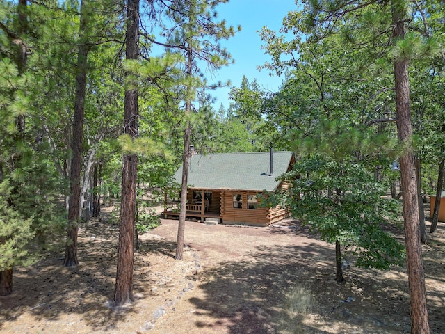 27401 Goodman Rd, Fall River Mills, CA 96028 - back of house with log siding and a wooden deck