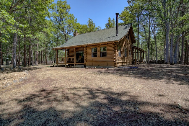 27401 Goodman Rd, Fall River Mills, CA 96028 - view of side of property featuring log siding and a chimney