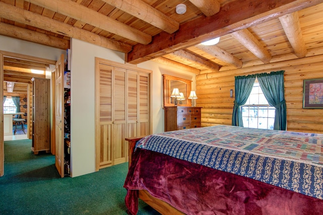 27401 Goodman Rd, Fall River Mills, CA 96028 - bedroom featuring a wooden ceiling with exposed beams, carpet flooring, a closet, and rustic walls