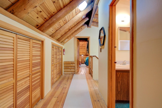 27401 Goodman Rd, Fall River Mills, CA 96028 - corridor with light wood-style flooring and wood ceiling