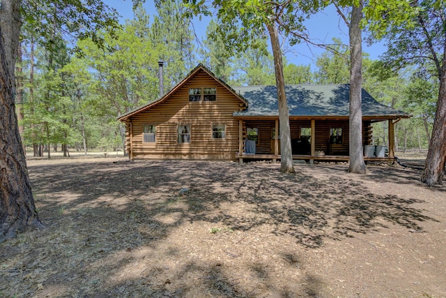 27401 Goodman Rd, Fall River Mills, CA 96028 - rear view of house with log siding, a shingled roof, and a porch