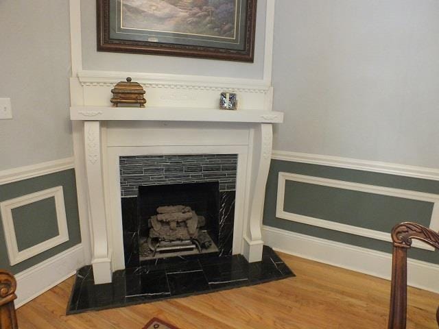 interior details with hardwood / wood-style floors and a fireplace