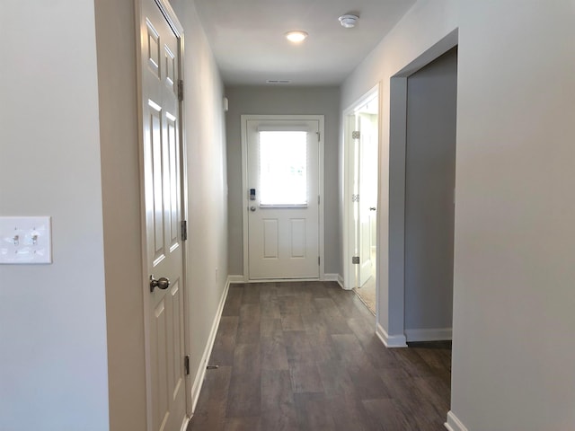 doorway featuring dark hardwood / wood-style flooring