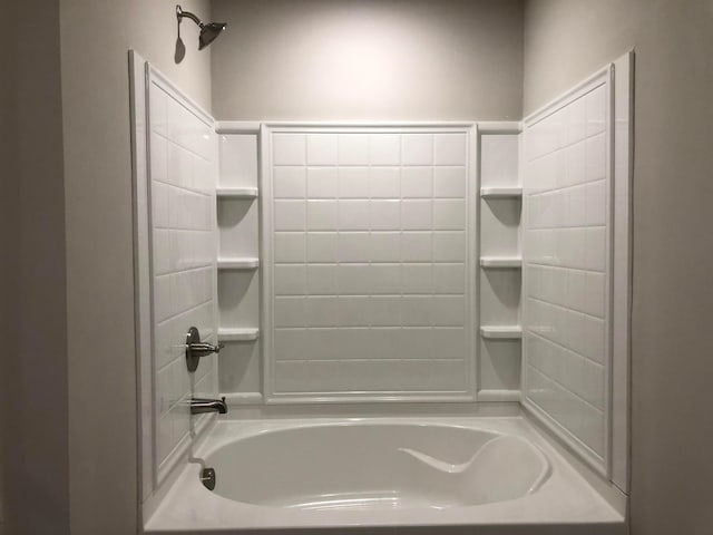 bathroom with bathing tub / shower combination