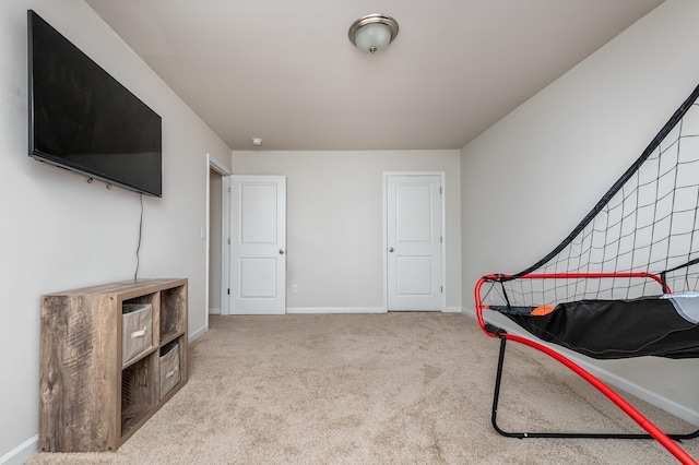 game room with light colored carpet